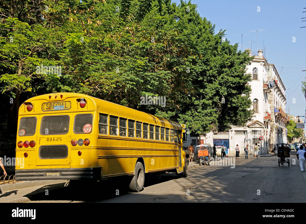 old yellow US-schoolbus on Cuba, La Habana, capital city of Havana, Cuba, Caribbean Stock Photo