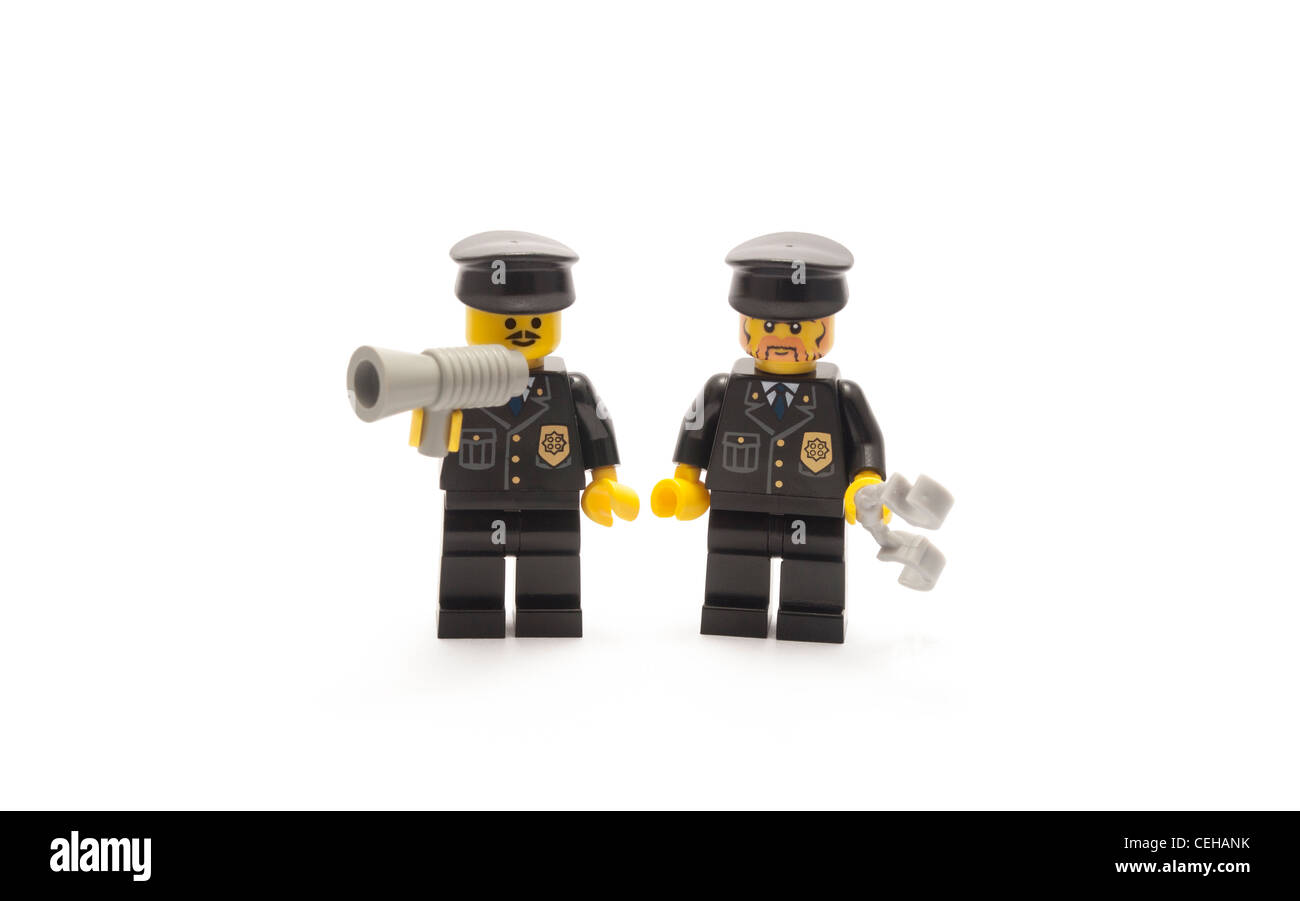 Two Lego Police officers with loud hailer and handcuffs Stock Photo