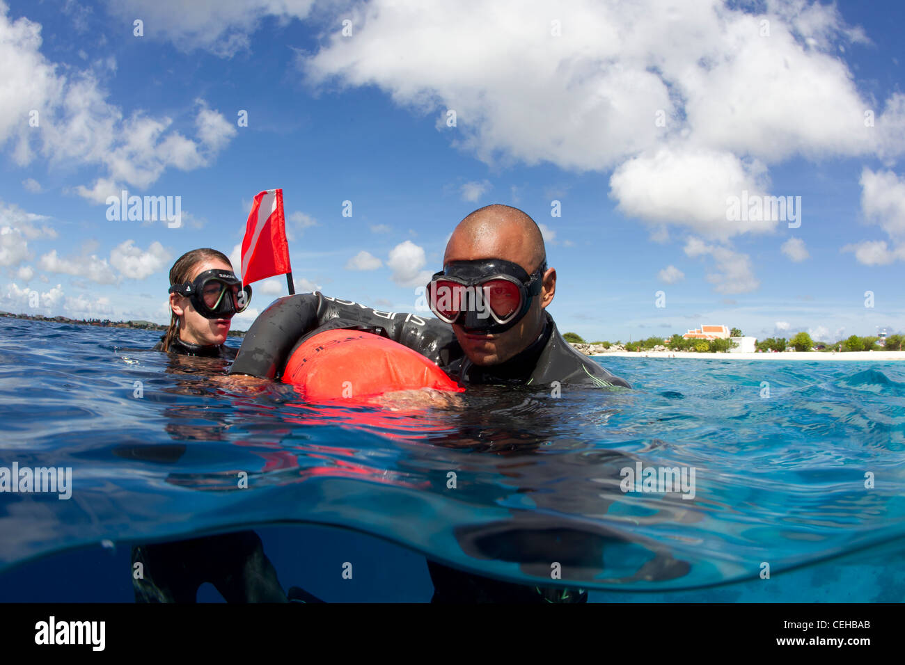 Freedivers catch breath at surface Stock Photo Alamy