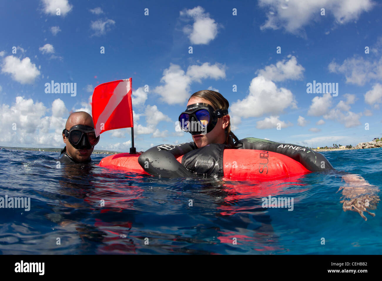 Freedivers catch breath at surface Stock Photo