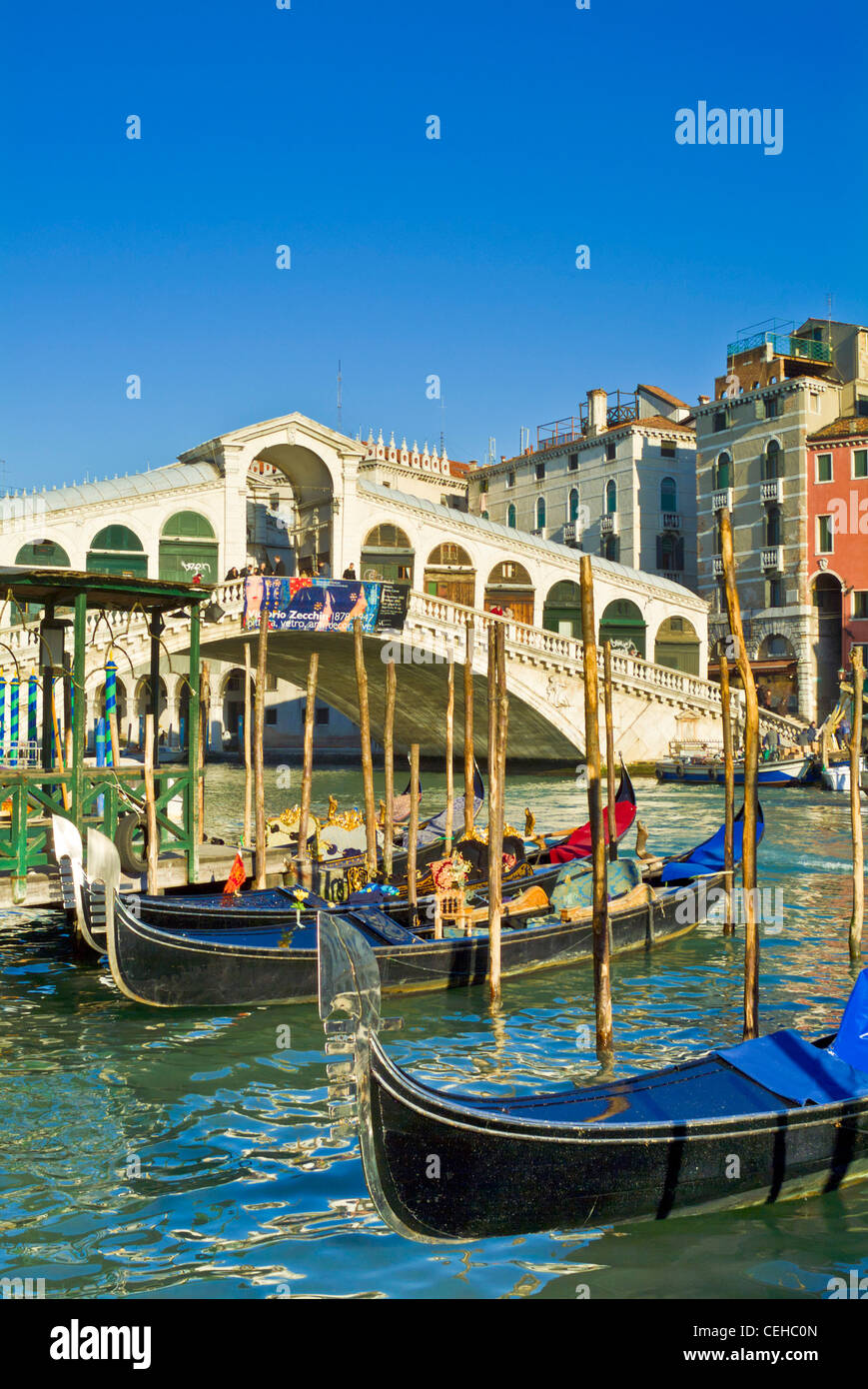 Italy venice italy Gondolas moored by the Fondementa del Vin showing the Rialto bridge Ponte del Rialto over the Grand canal Venice italy eu europe Stock Photo
