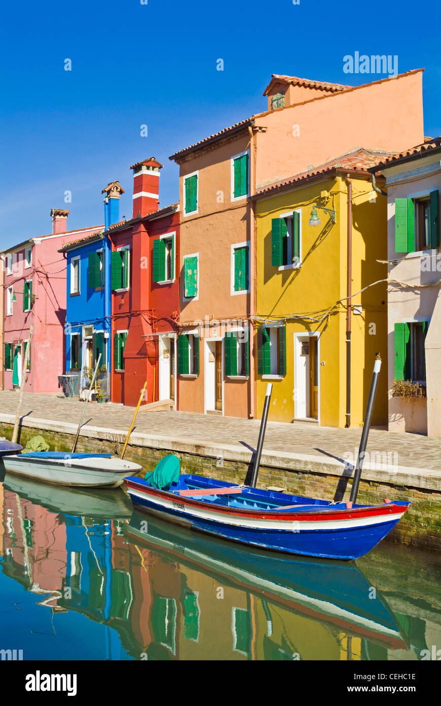brightly coloured fishermans cottages on the island of Burano in the Venice lagoon italy eu europe Stock Photo