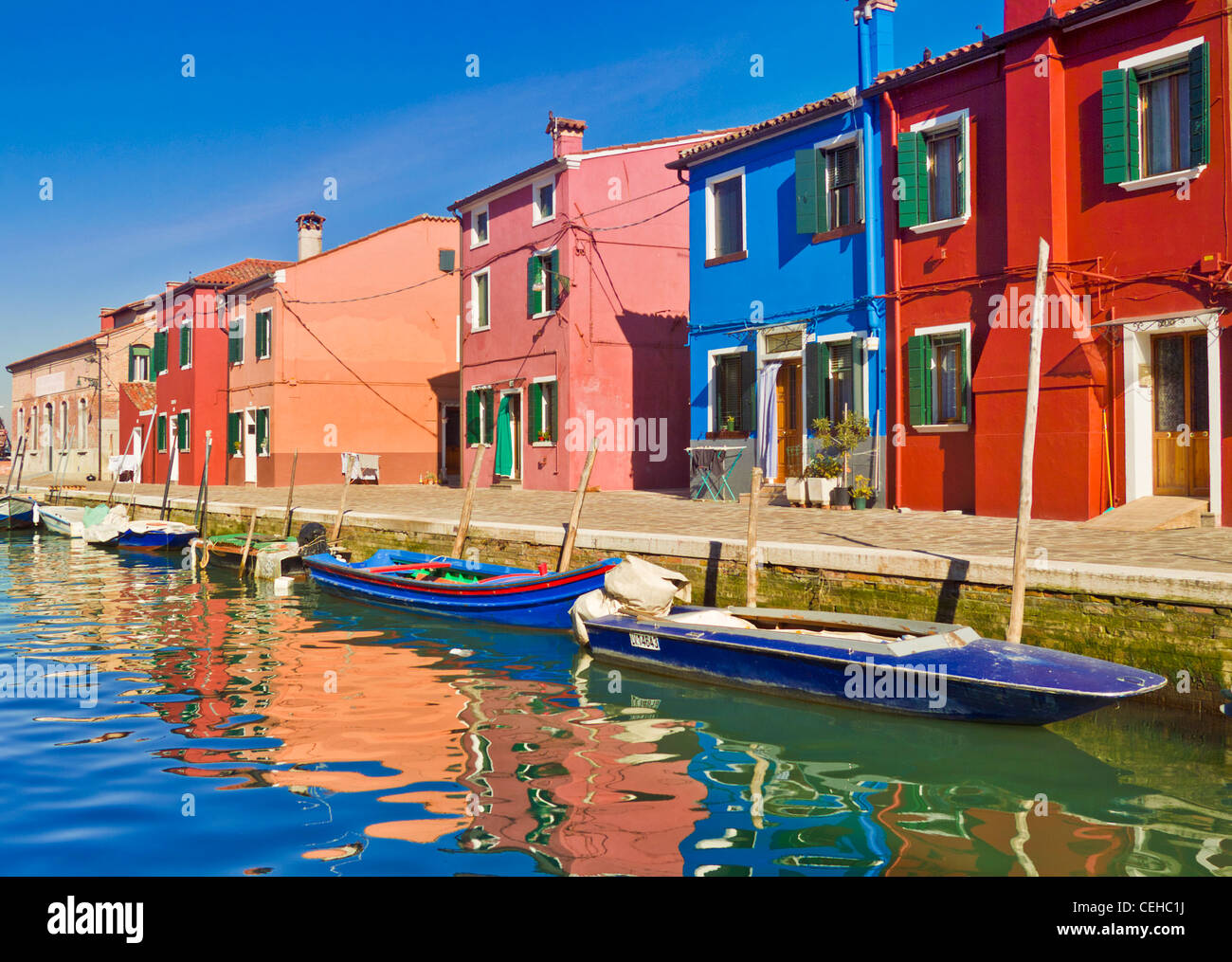 brightly coloured fishermans cottages on the island of Burano in the Venice lagoon italy eu europe Stock Photo