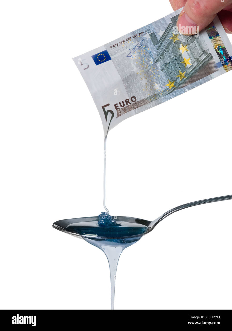 A 5 Euro banknote melting into a spoon. Stock Photo