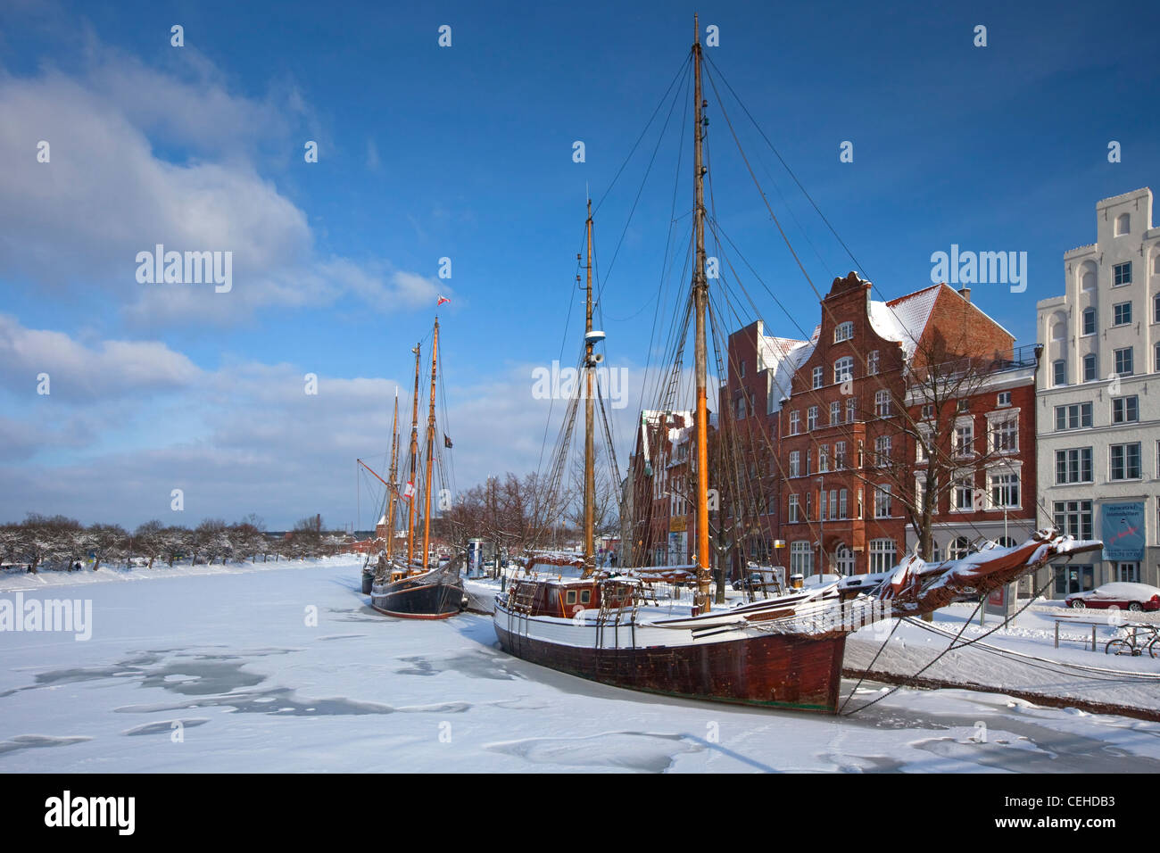 Sailing ship in the snow in winter in the harbour museum at the Hanseatic City of Lübeck, Obertrave, Germany Stock Photo