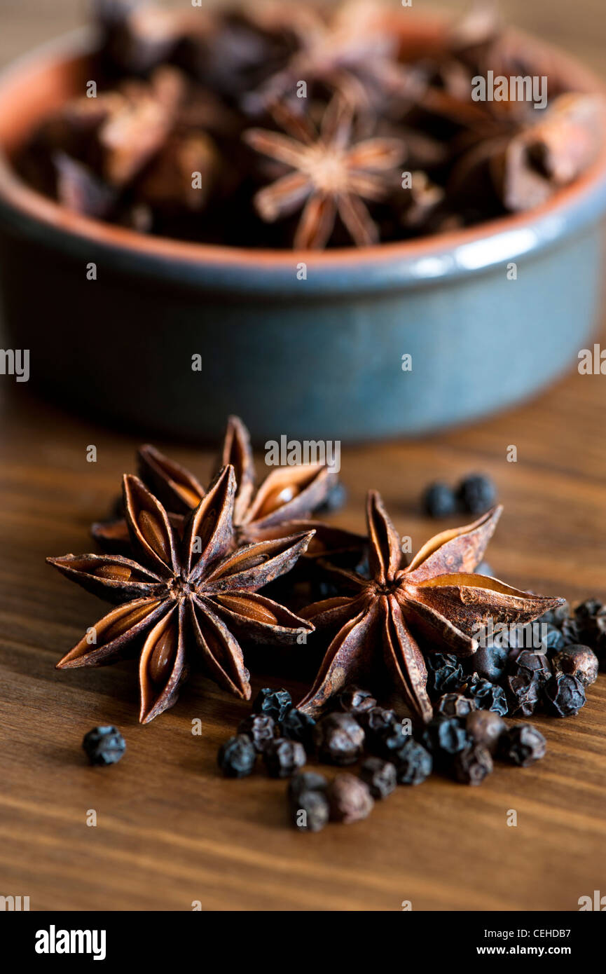 Star Anise, Illicium verum, and Black Peppercorns, Piper nigrum Stock Photo