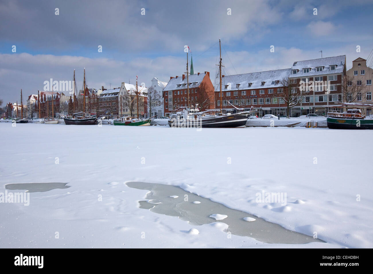 Sailing ship in the snow in winter in the harbour museum at the Hanseatic City of Lübeck, Obertrave, Germany Stock Photo