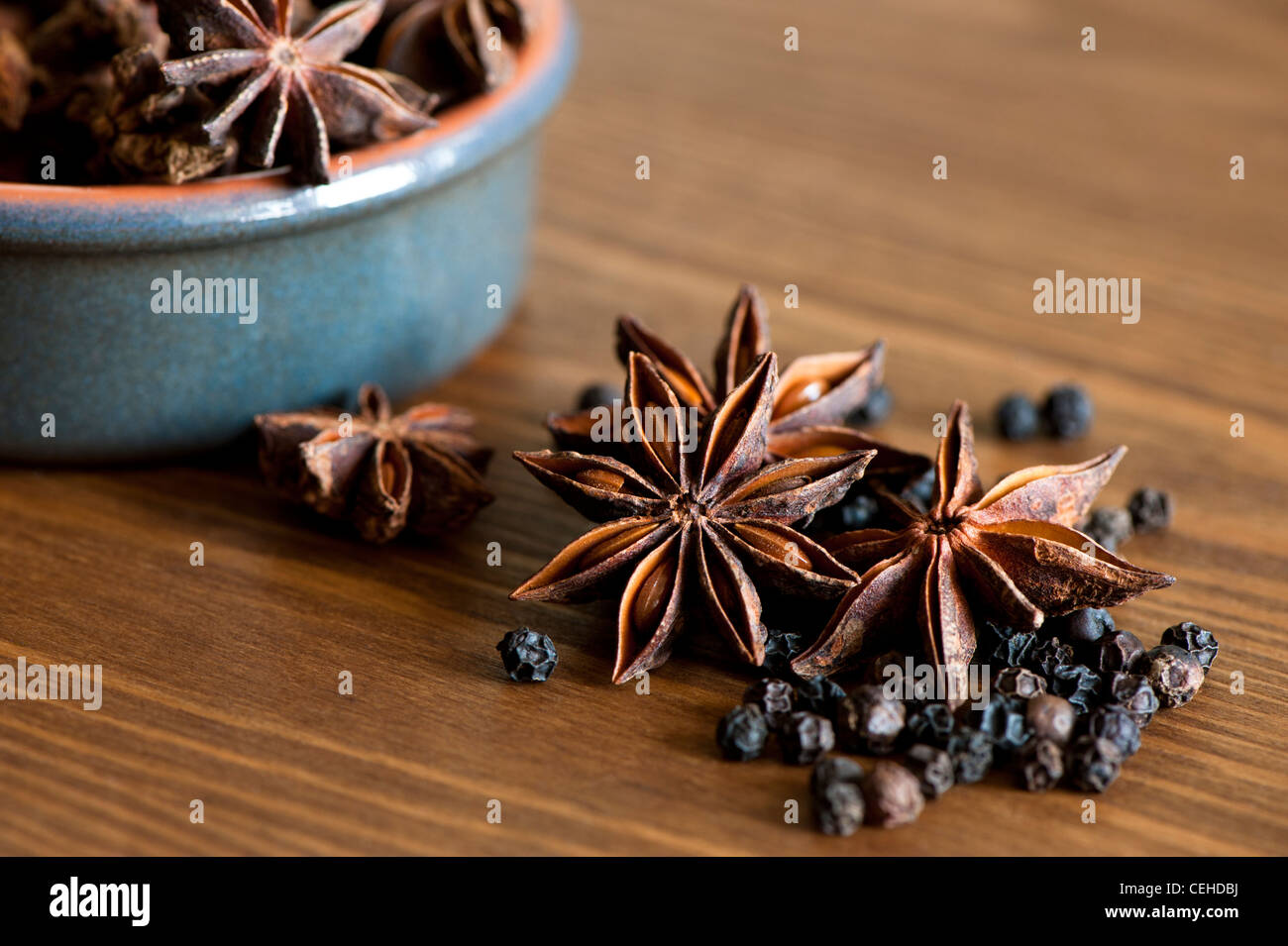 Star Anise, Illicium verum, and Black Peppercorns, Piper nigrum Stock Photo