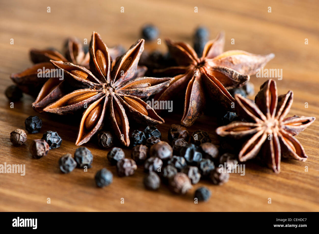 Star Anise, Illicium verum, and Black Peppercorns, Piper nigrum Stock Photo