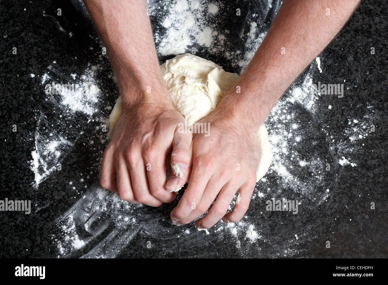 Hands kneading a dough Stock Photo Alamy