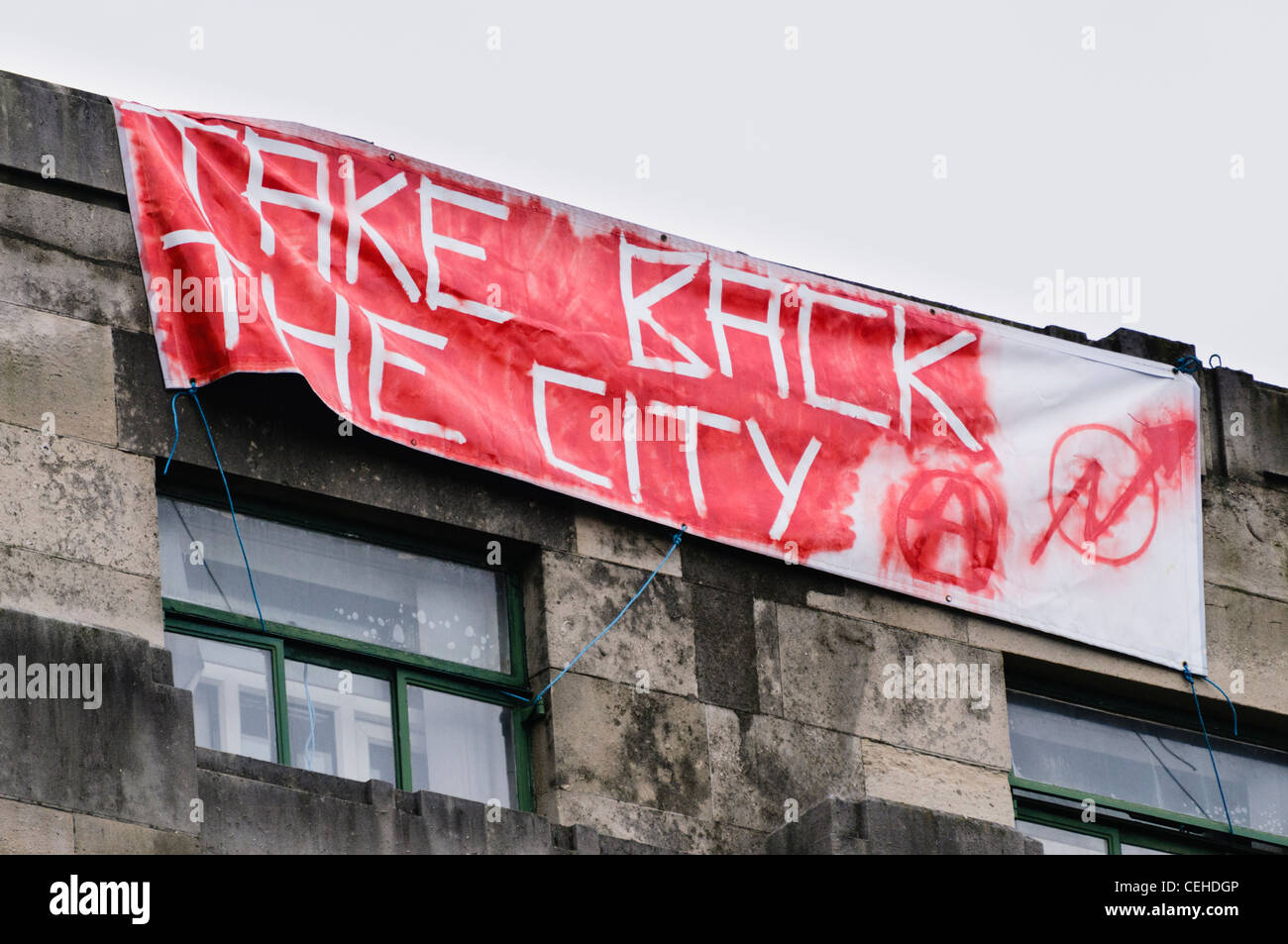 Sign from Occupy Belfast calling on people to 'Take Back the City' Stock Photo