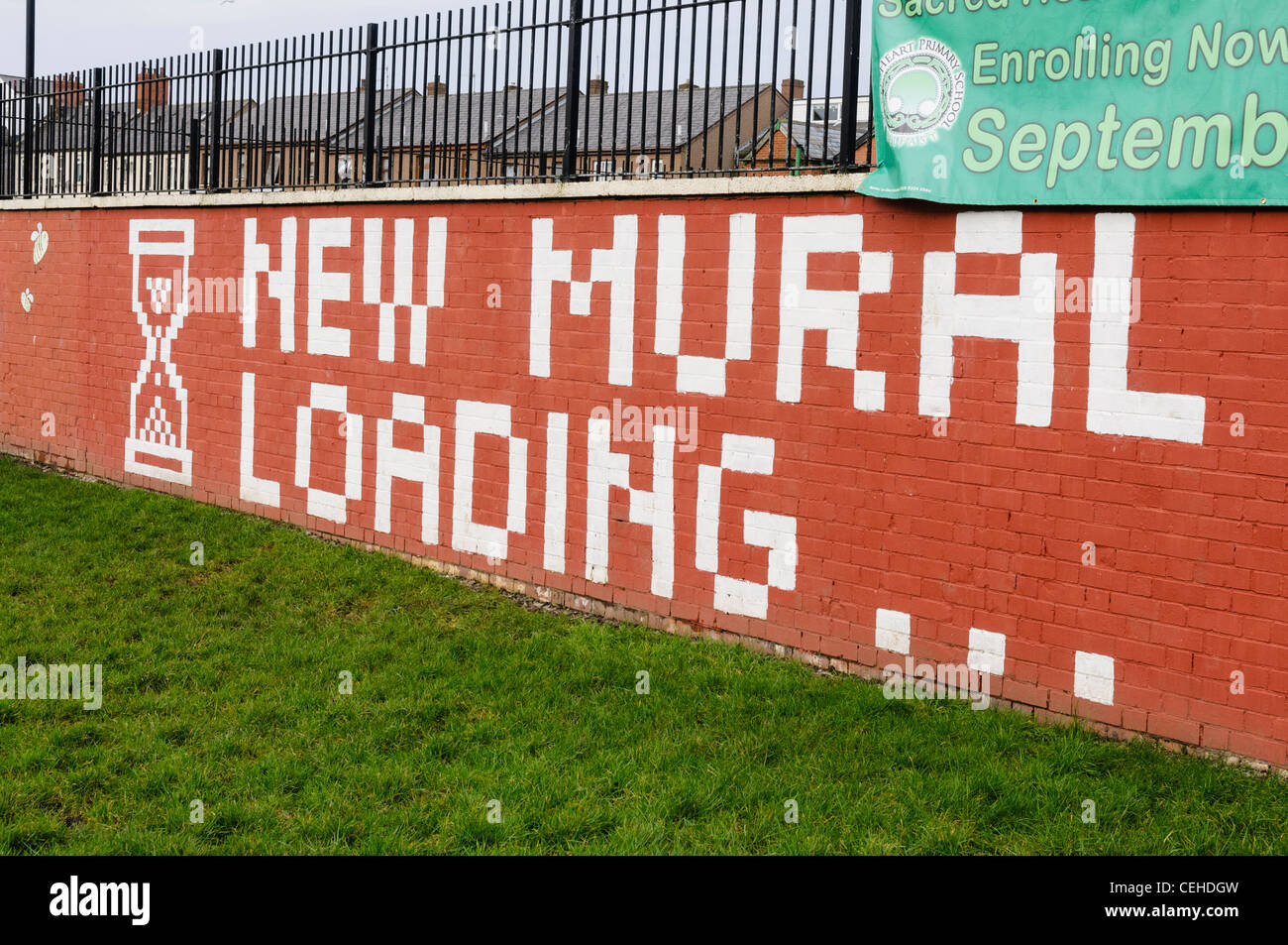 Mural in North Belfast 'New Mural Loading...' Stock Photo