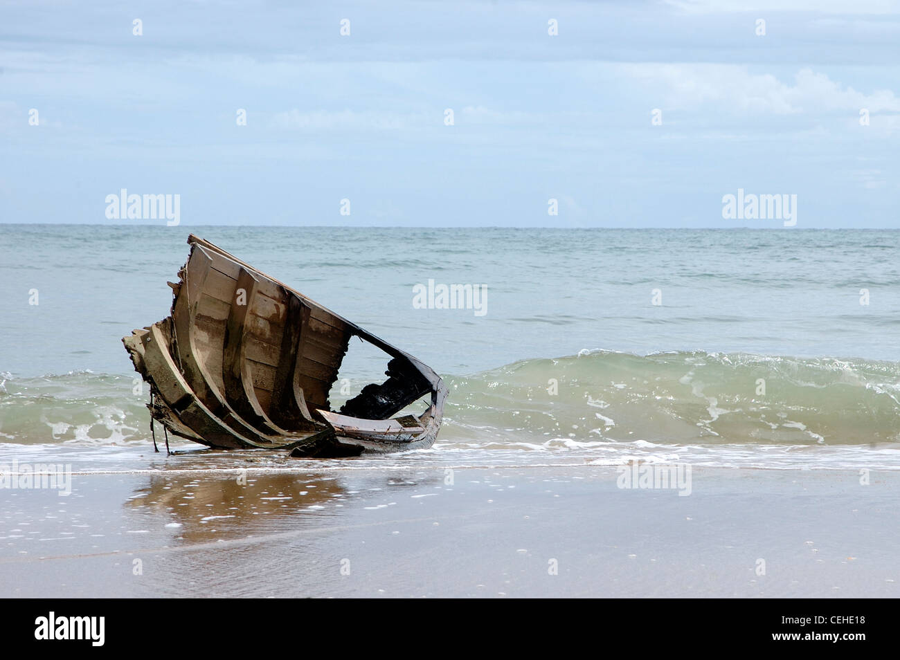A piece of broken fishing boat washed up on the shore following the