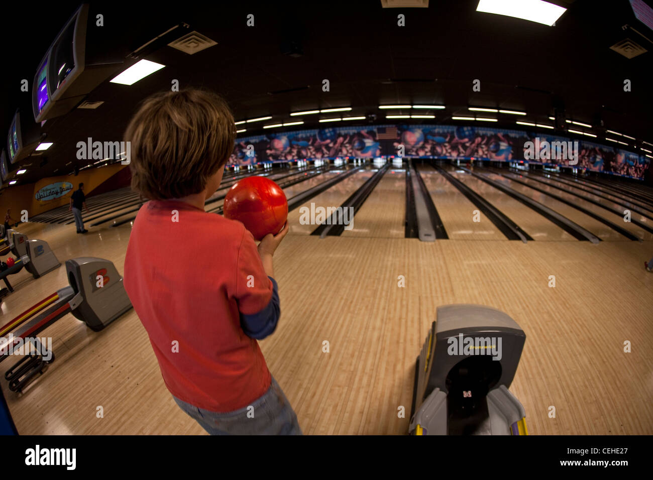 Ten year old bowling, bowling alley, United States. Stock Photo