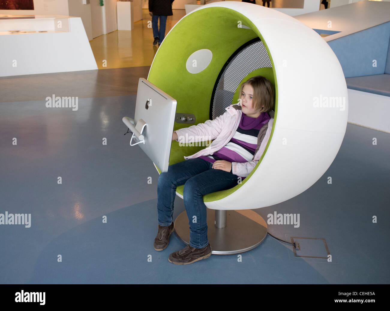 Young girl visitor using multimedia area at Humboldt Box visitors center at Lustgarten on Unter den Linden Mitte Berlin Stock Photo