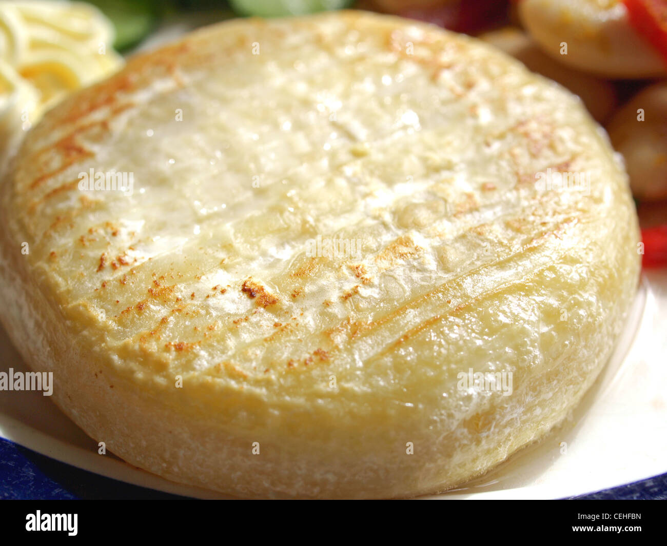 Vegetarian main dish including cheese, mayonnaise, curry beans, peppers and cucumbers Stock Photo