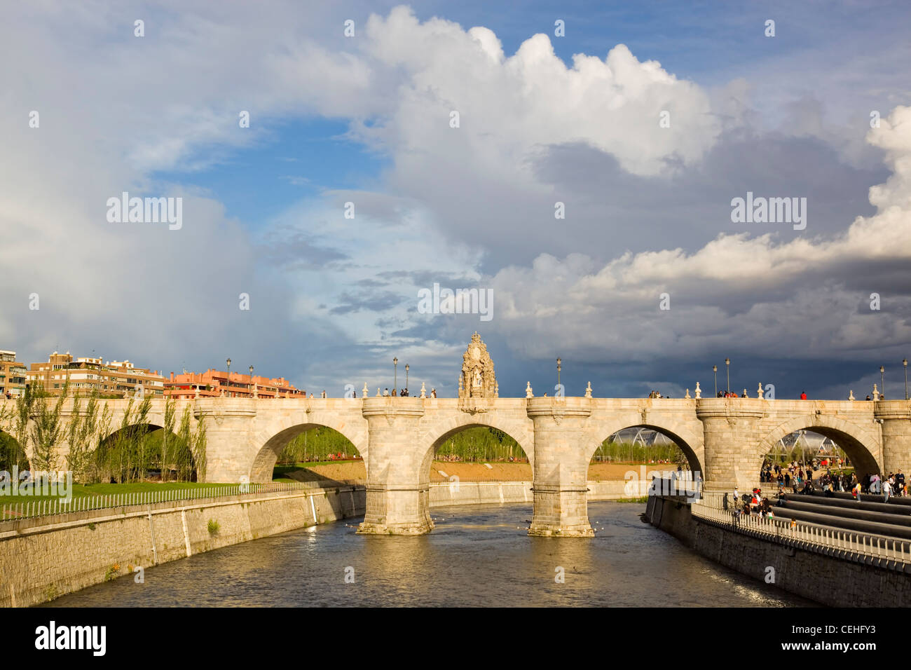 Far view of the old brigde of Toledo, in Madrid, Spain; against a cloudy sky Stock Photo