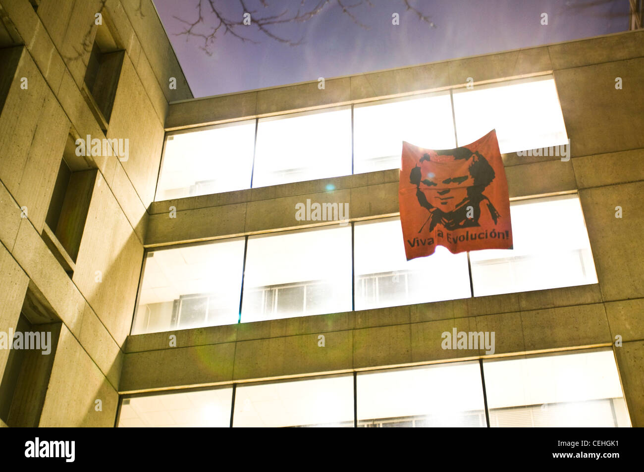To celebrate Darwin's 200th birthday, MIT hackers put a large red banner with a Che Guevara-style image of Charles Darwin and the words "Viva la Evolucion!" on the skybridge between buildings 18 and 56 on 2/11/09. Stock Photo