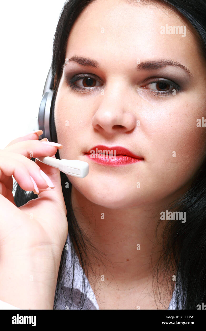 modern business woman with headset microphone sitting at office desk Stock Photo