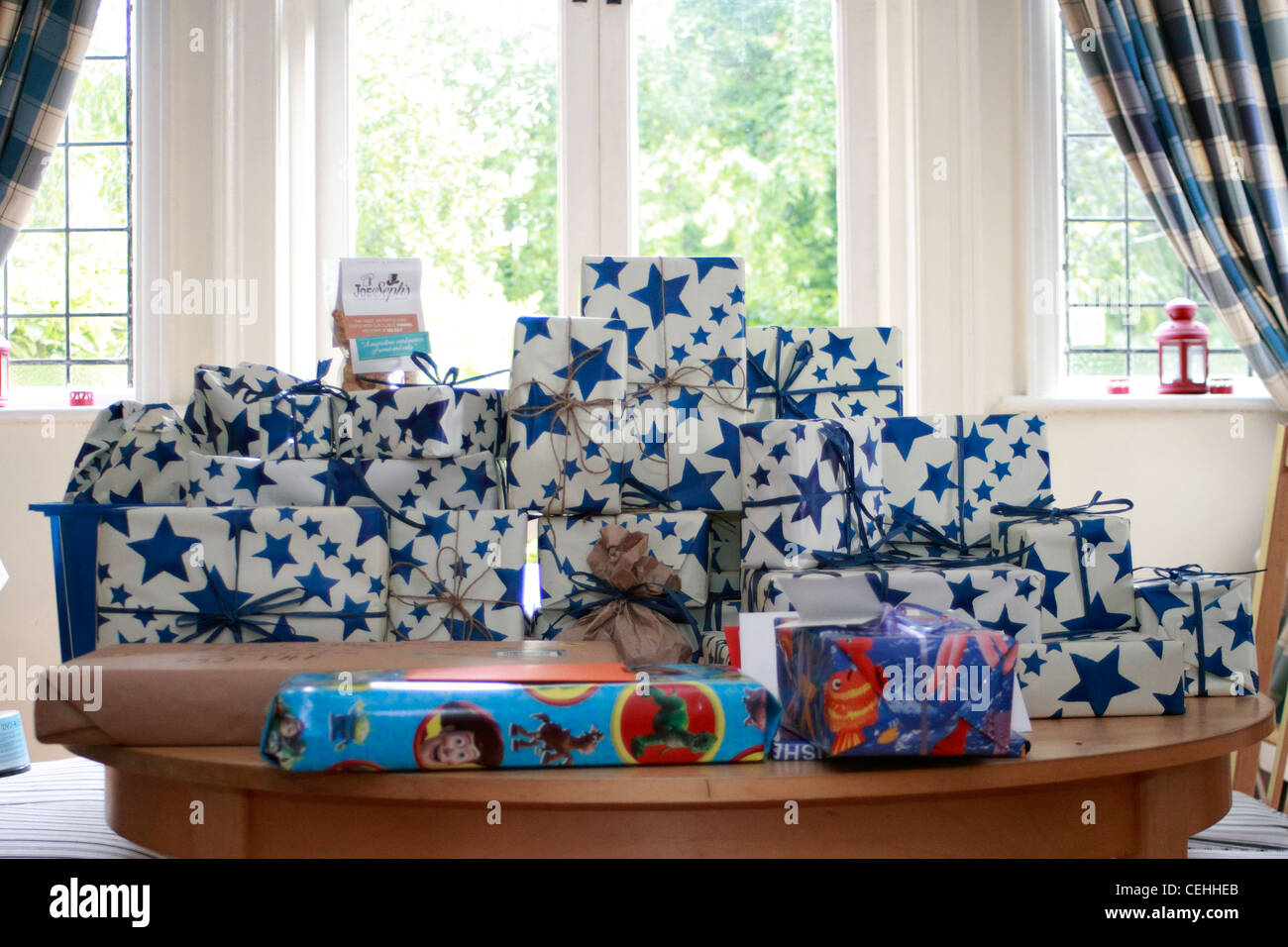 Pile of presents for Lewis on his tenth birthday Stock Photo