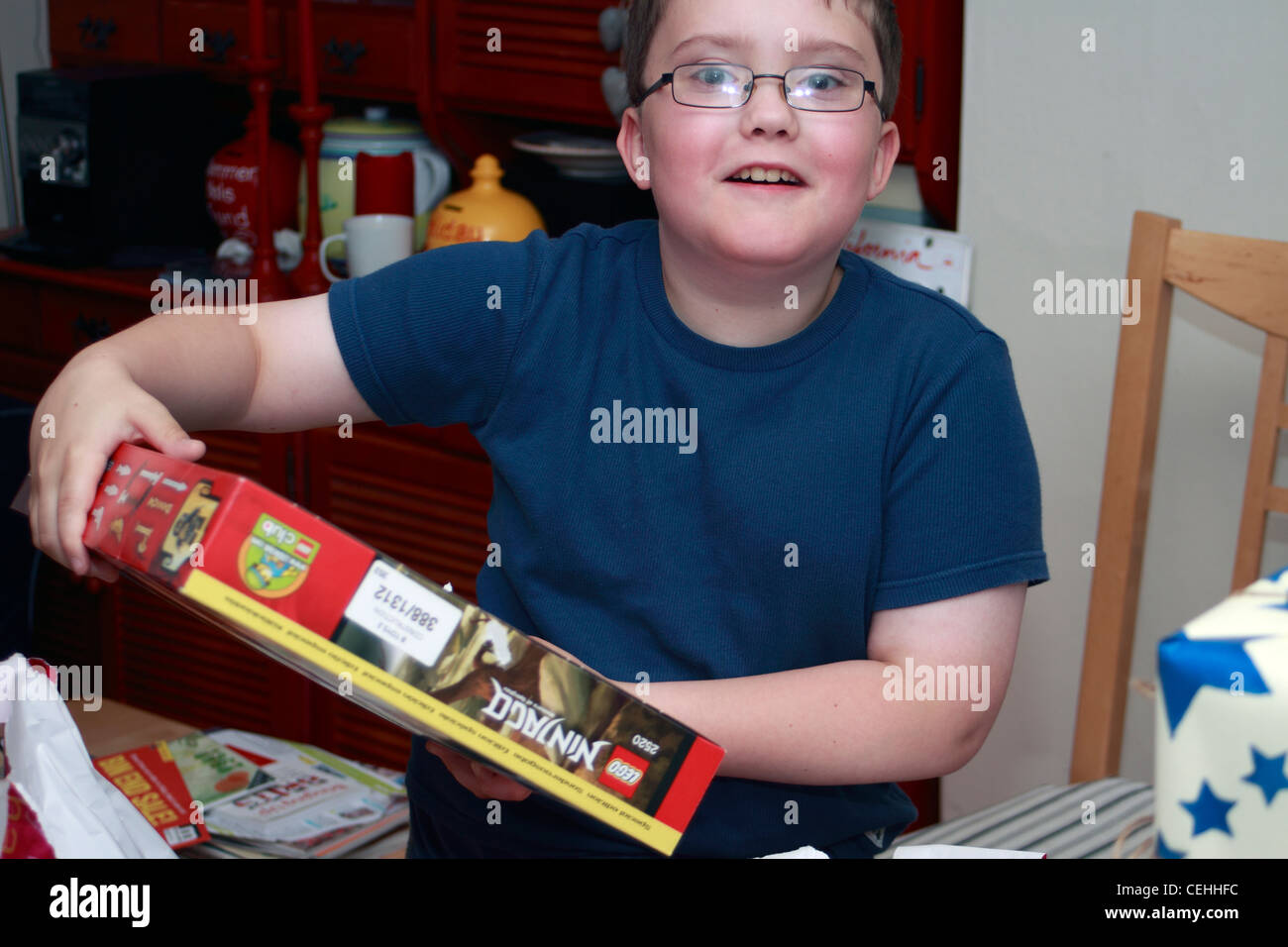 Lewis opening his presents on his tenth birthday Stock Photo
