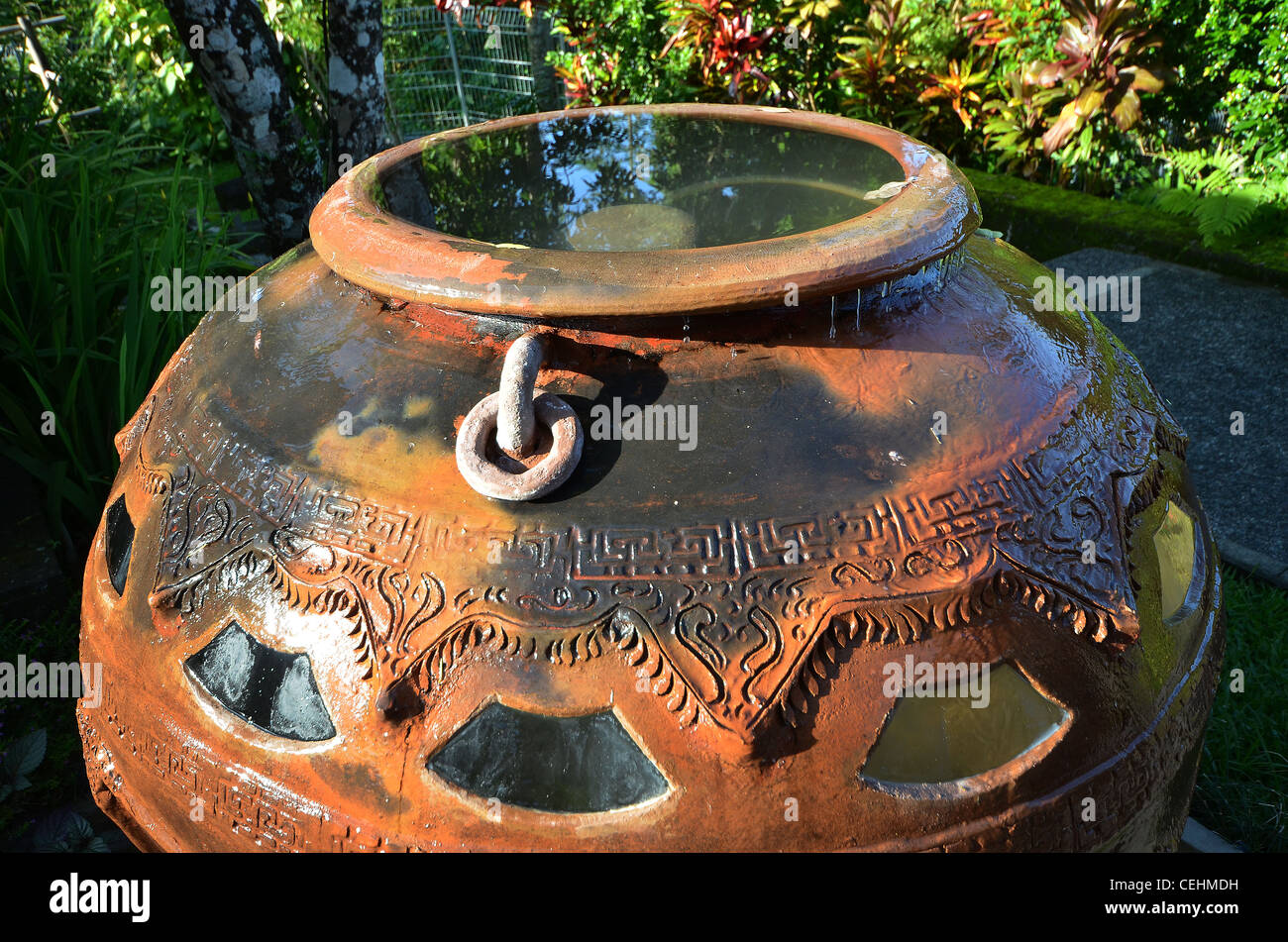 Large terracotta earthenware pot and water feature with balinese design