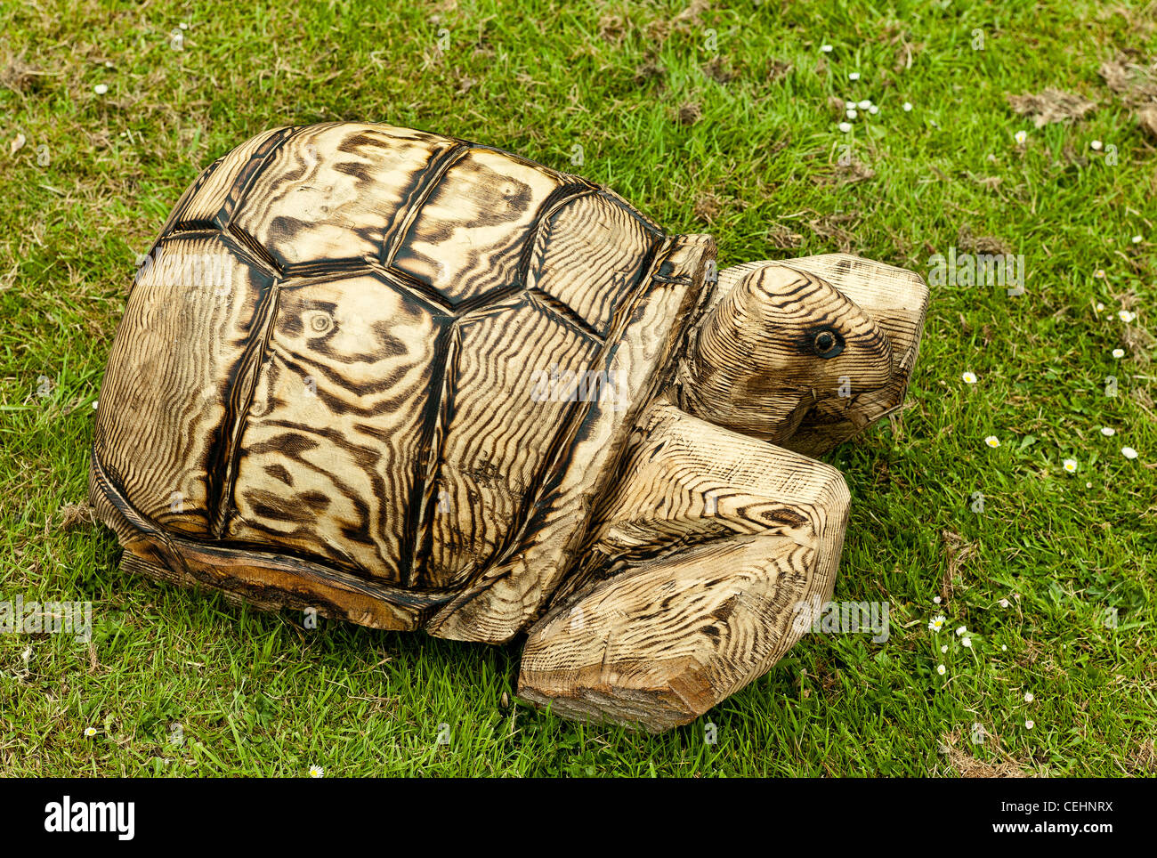 Wooden tortoise as garden ornament Stock Photo