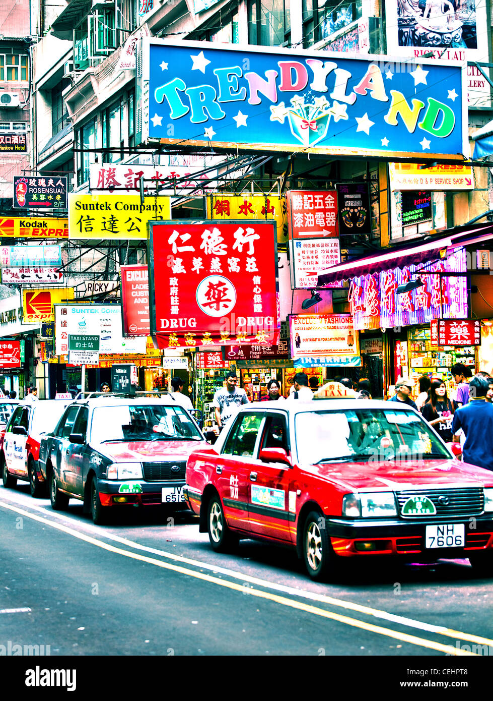 Colour portrait of a taxi rank in Hong Kong,China featuring chinese signs and a row of taxi's. Stock Photo