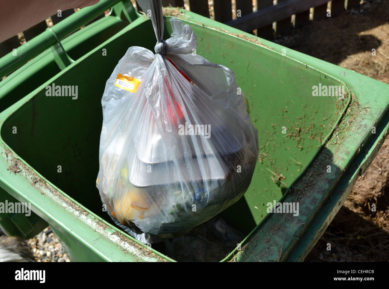 putting rubbish in the bin Stock Photo