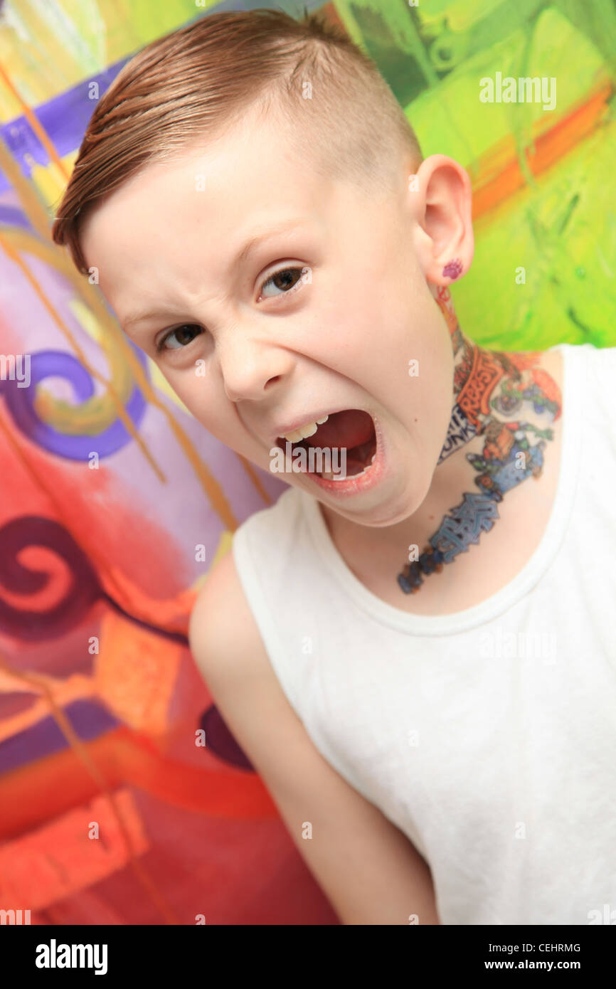 Portrait of an 8 year old boy with a tattoo and attitude Stock Photo - Alamy