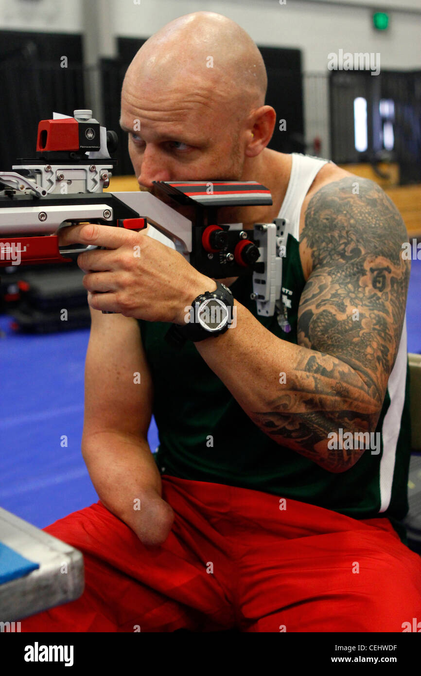 Active duty Australian sailor Paul de Gelder takes aim during air rifle practice at the Marine Corps Trials held on Marine Corps Base Camp Pendleton, Calif. He is a member of the International team competing in the Trials, which are hosted by the United States Marine Corps Wounded Warrior Regiment. Stock Photo