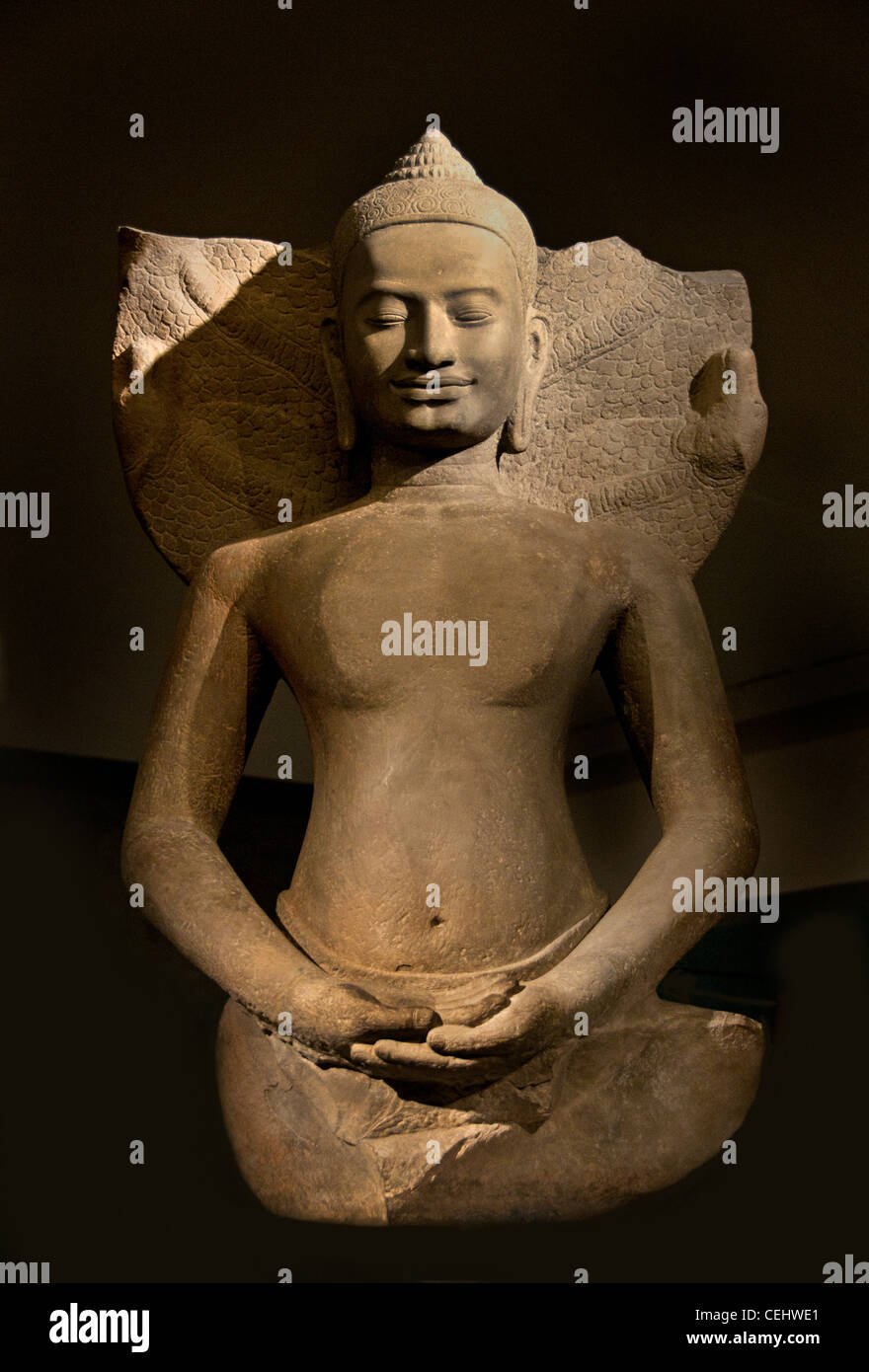 Buddha protected by the Naga 12 - 13th century Bayon style Preah Khan Kompong Svay Cambodian Cambodia Stock Photo