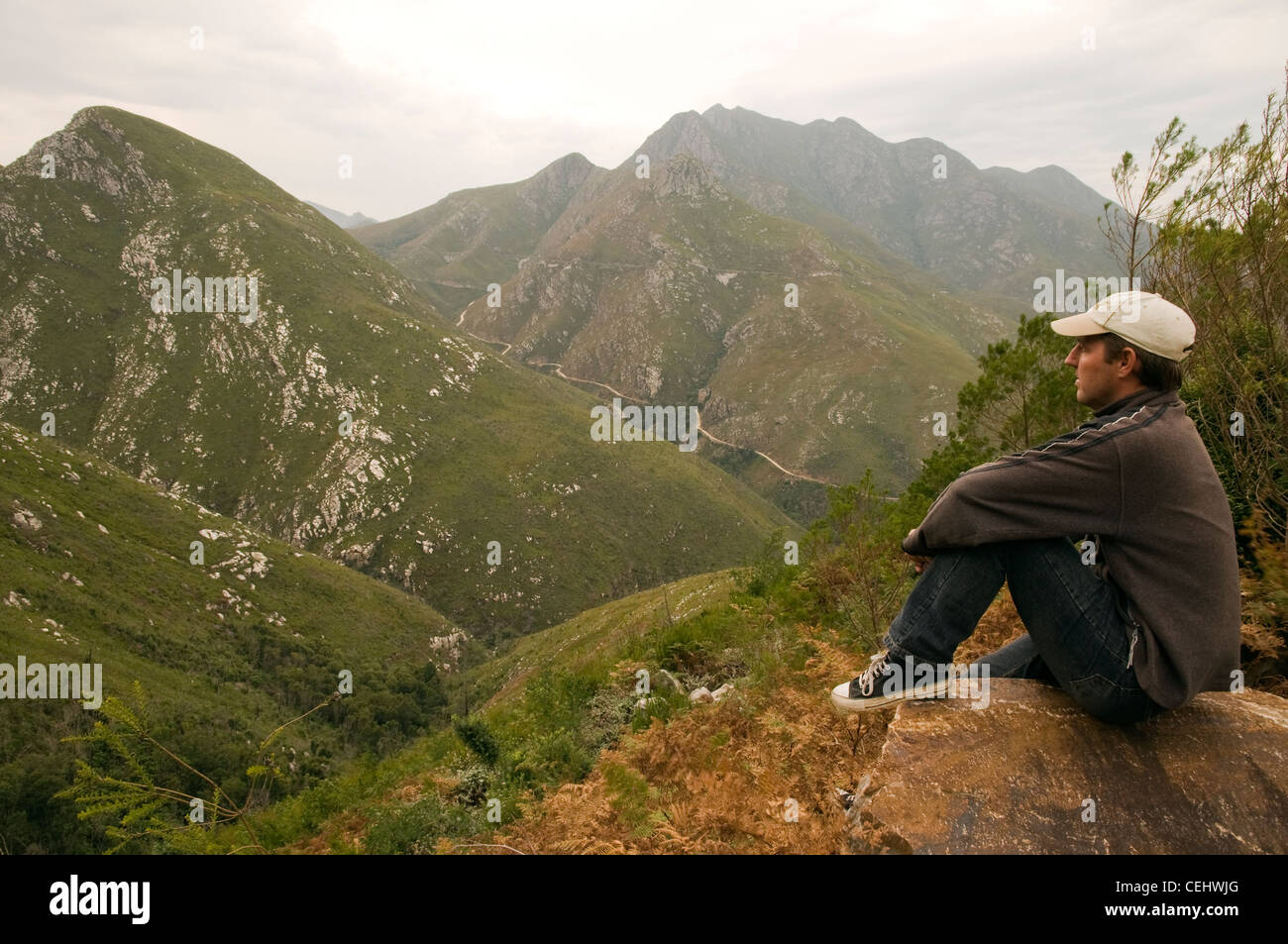 Tourist resting looking out over Prince Albert Pass,Western Cape ...