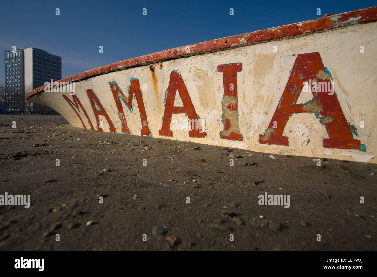 Mamaia resort name written on a wooden boat on the shore of the Black Sea in Constanta, Romania Stock Photo