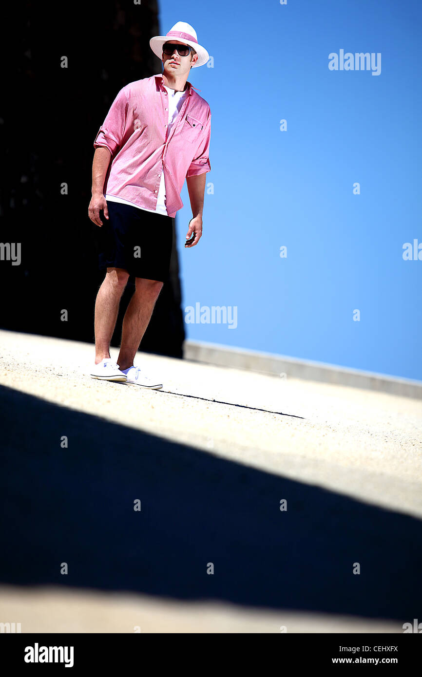 Summer male fashion. Pink Cardigan. Panama hat Stock Photo Alamy