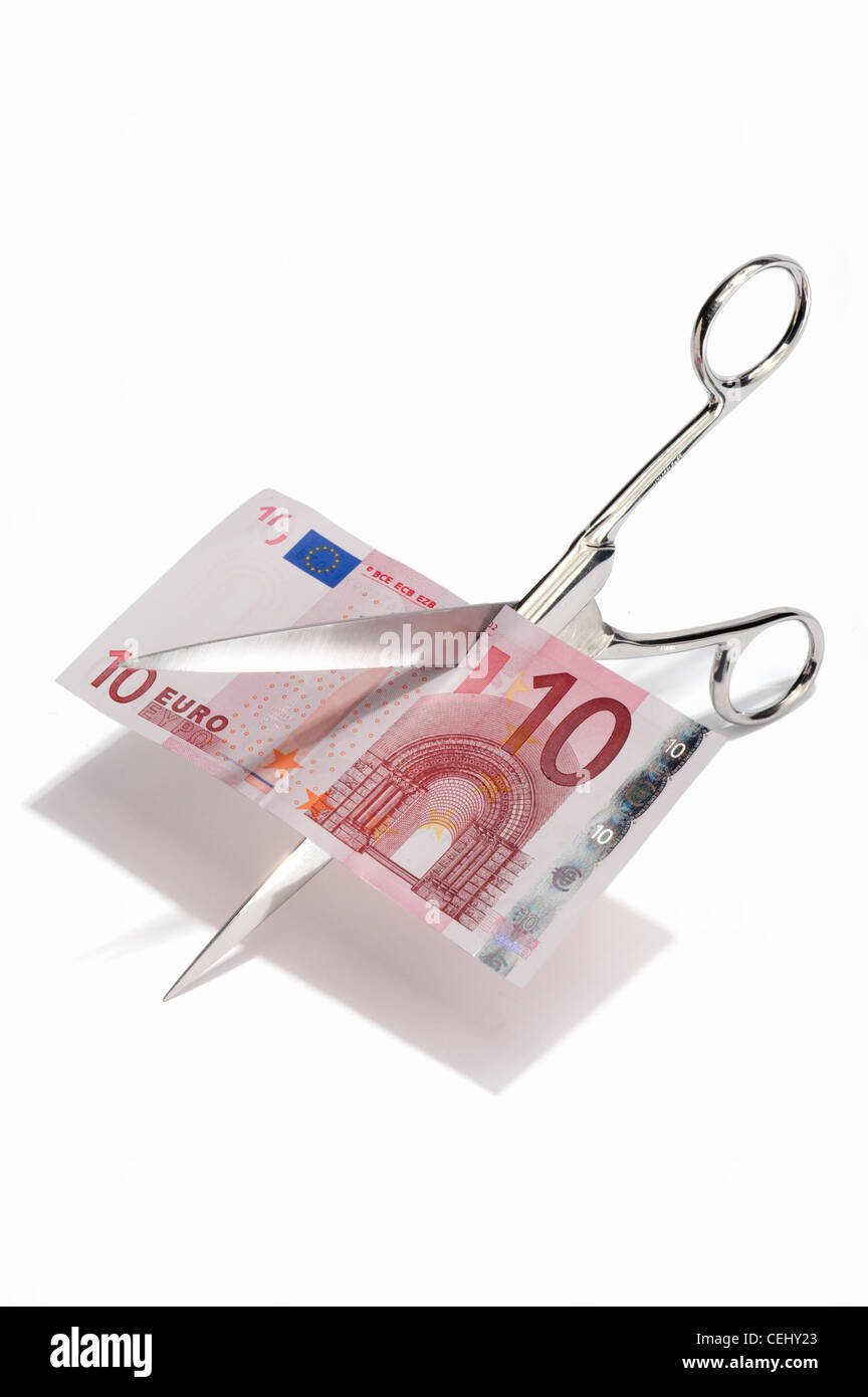 Scissors cutting up a 10 euro banknote Stock Photo