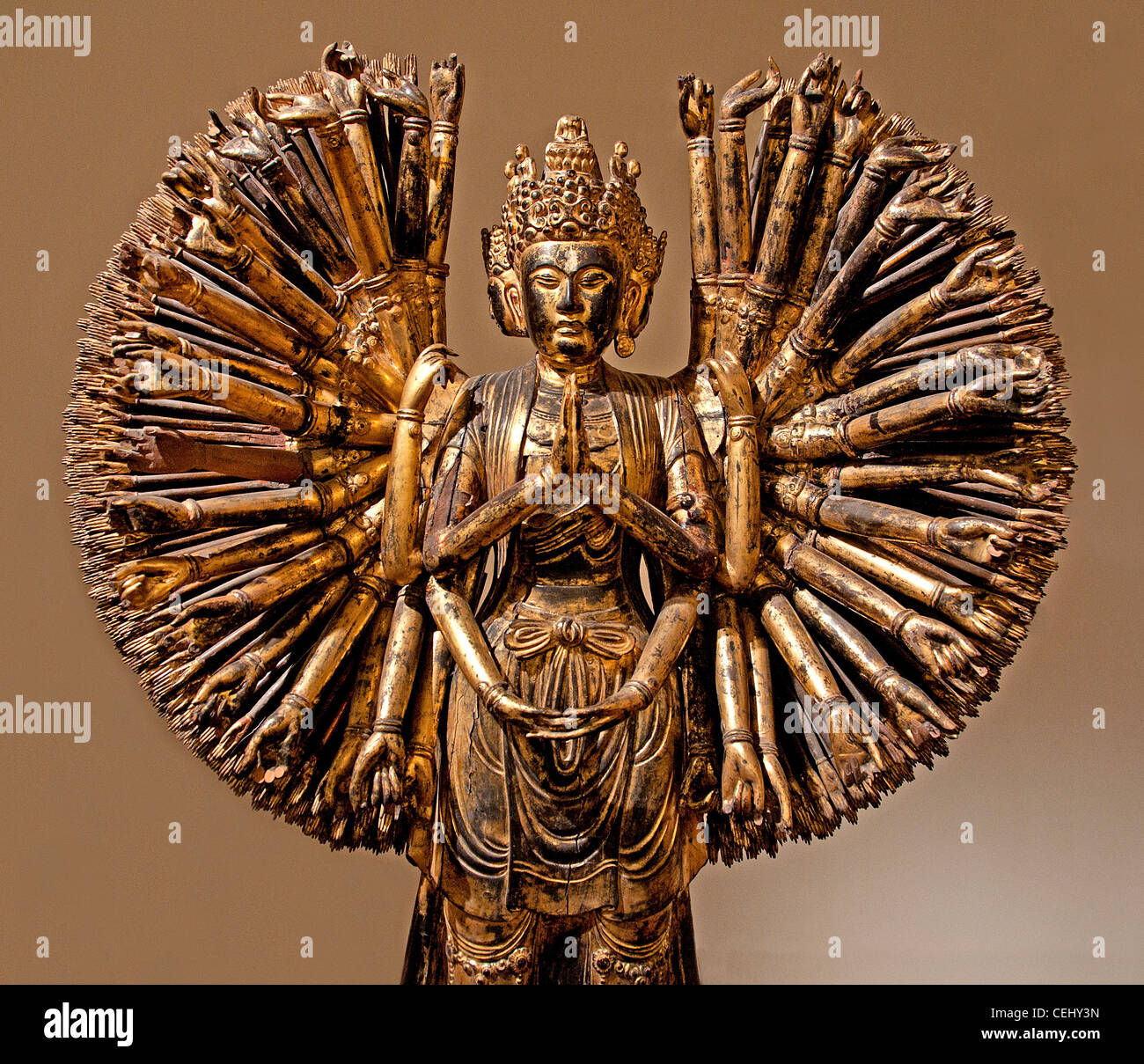 Bodhisattva Avalokitesvara Guanyin 1000 arms and eyes wood China 5 Dynasties Period 907-960 AD Chinese lacquered gilded wood Stock Photo