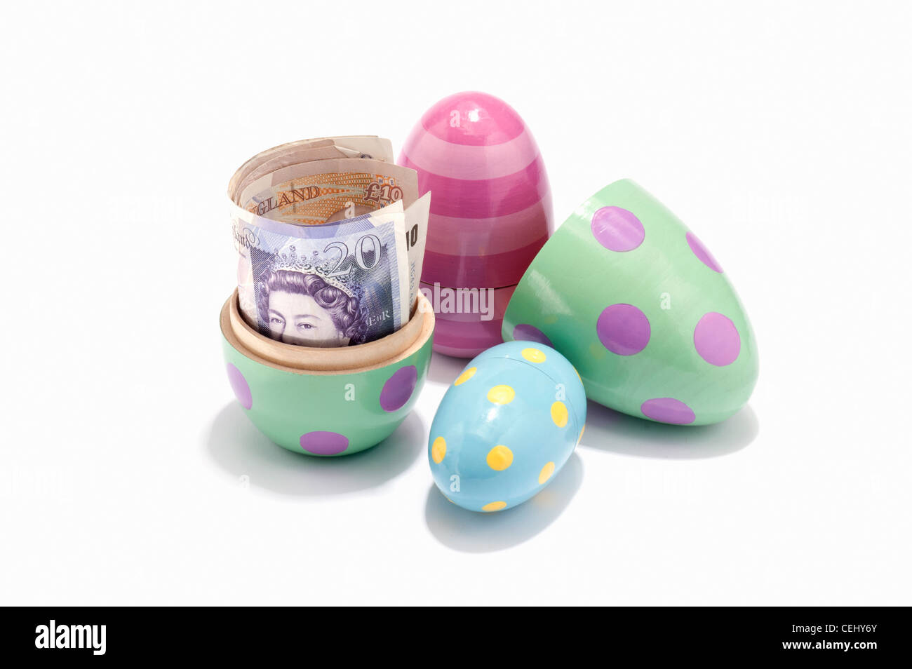 Easter eggs filled with British banknotes Stock Photo