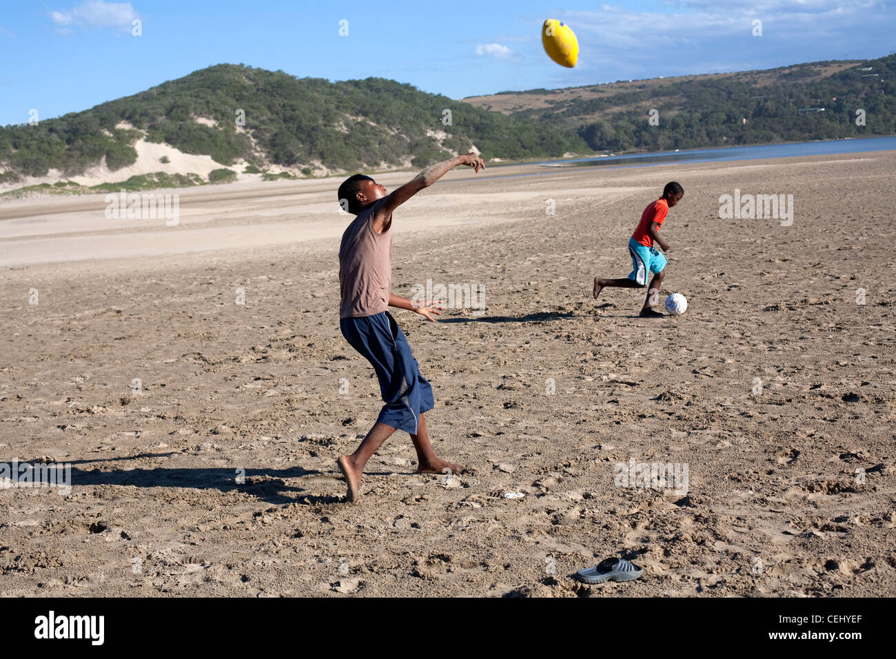 Kids playing soccer on a beach hi-res stock photography and images - Alamy
