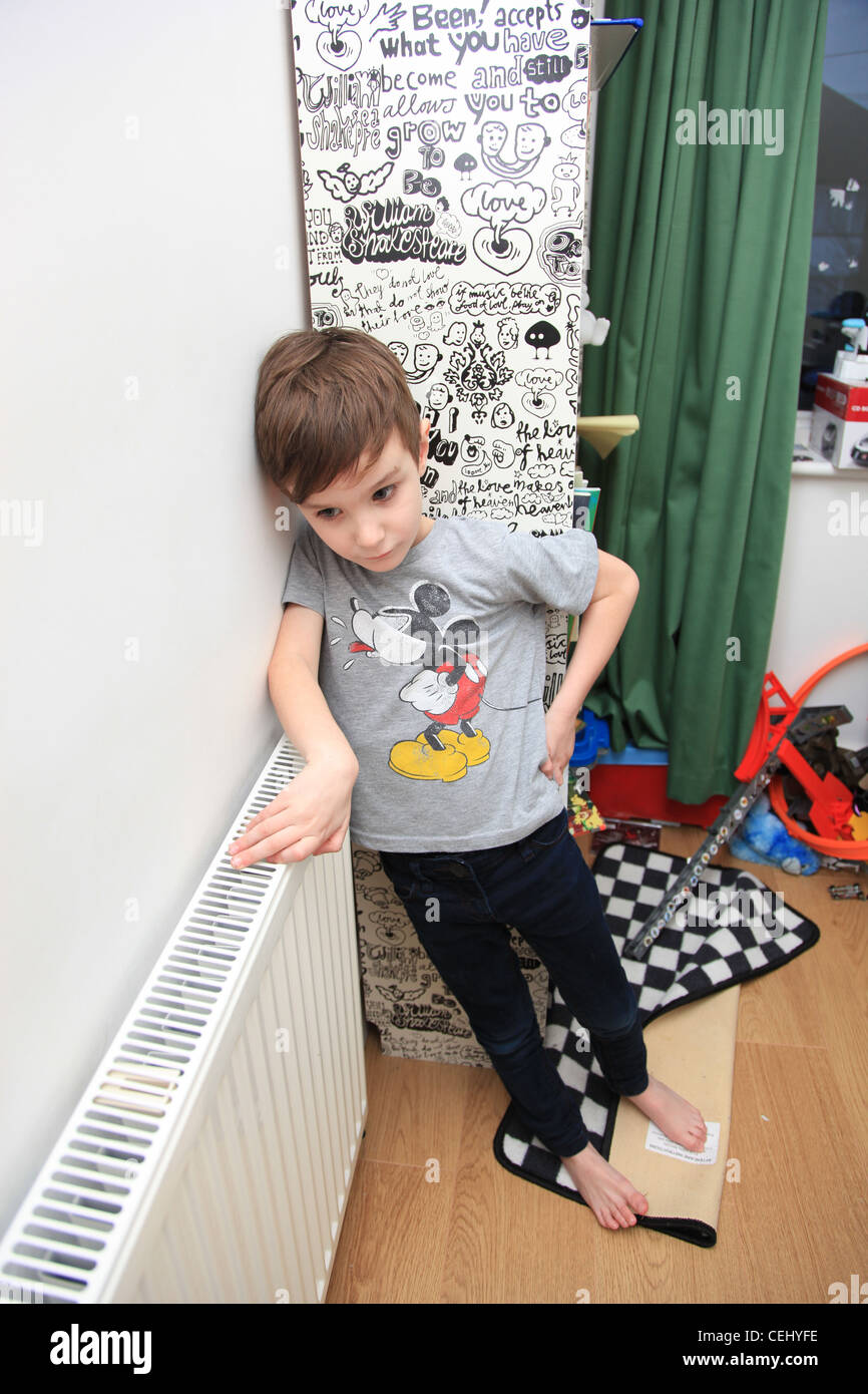 6 year old boy in the naughty corner Stock Photo Alamy