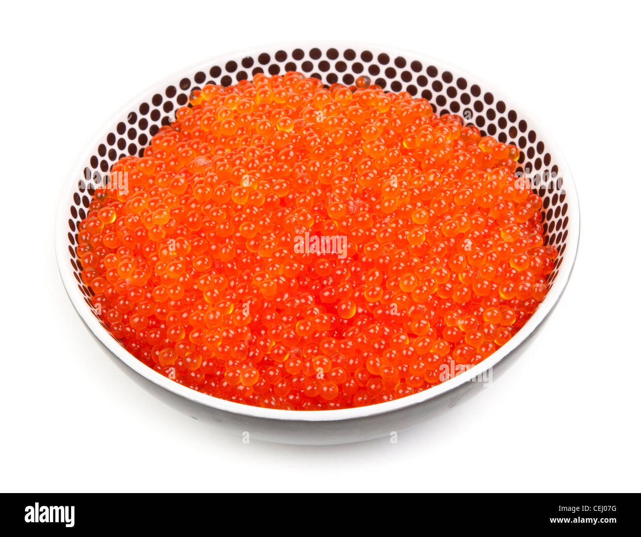 A plate full of fresh red caviar on white background Stock Photo