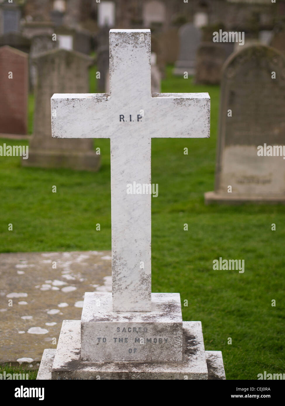 Gravestone with the Letters RIP Stock Photo