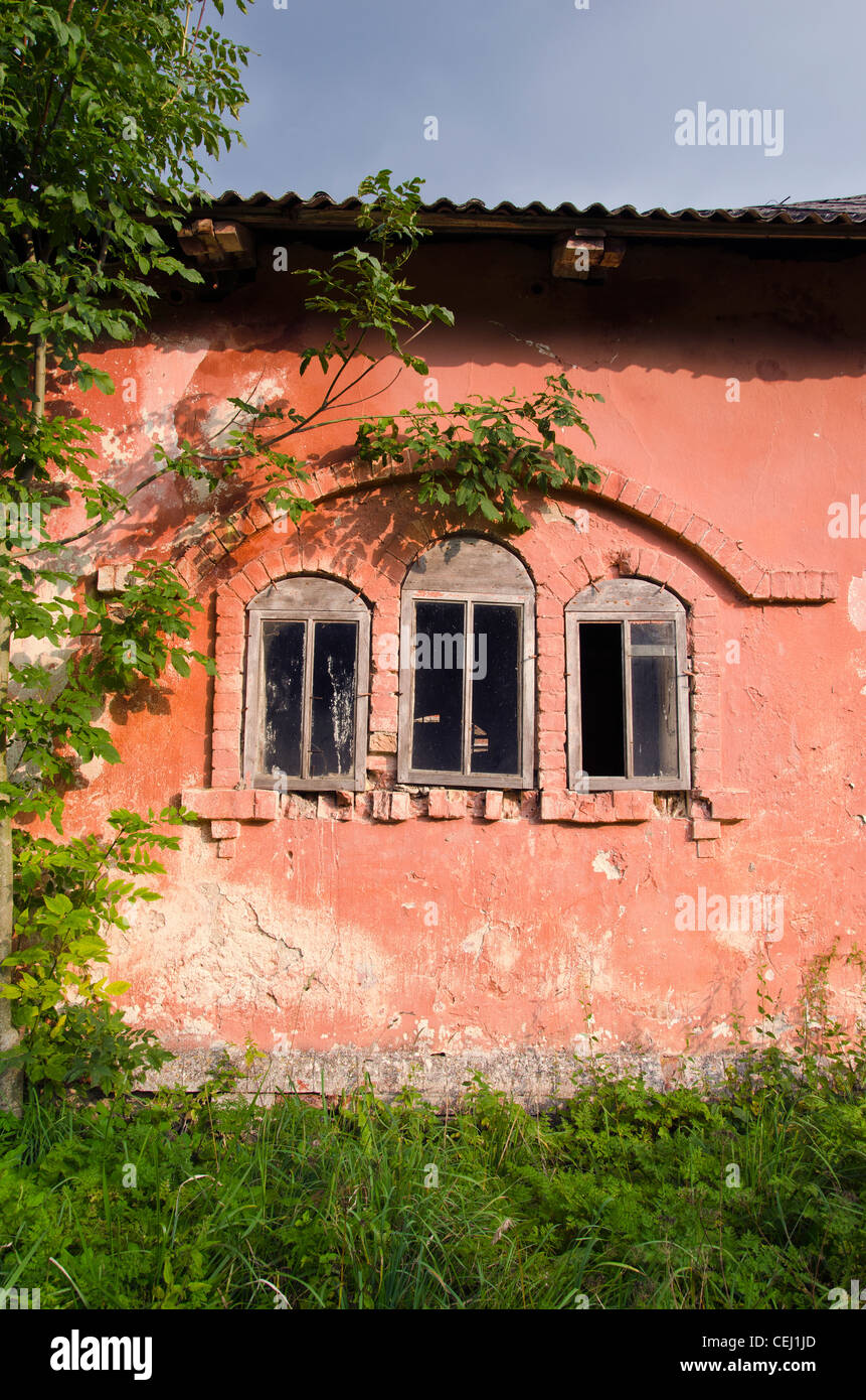 old building wall with three windows background Stock Photo - Alamy