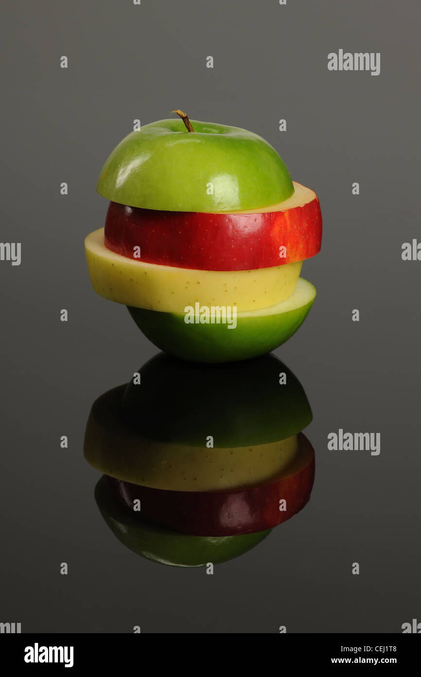 Apple slices grouped on a reflective surface Stock Photo