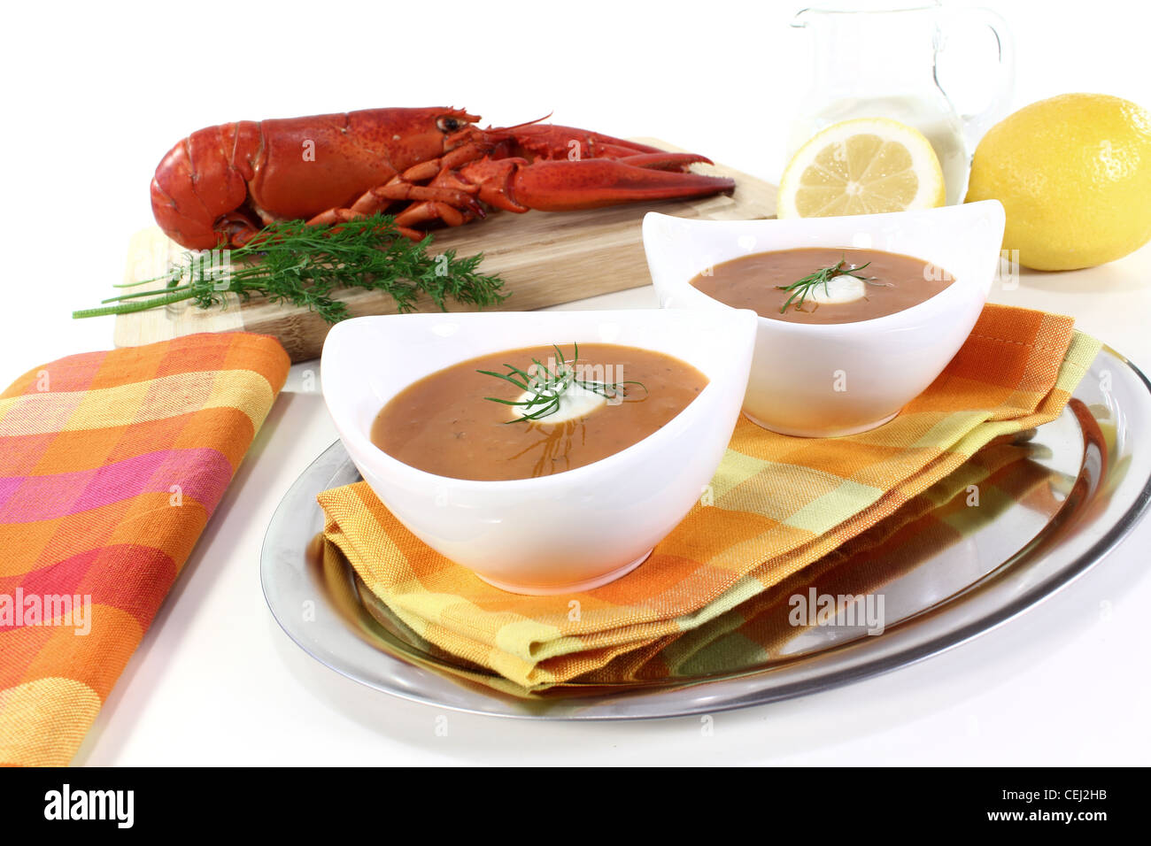 lobster soup with lemon, dill and cream dollop Stock Photo Alamy