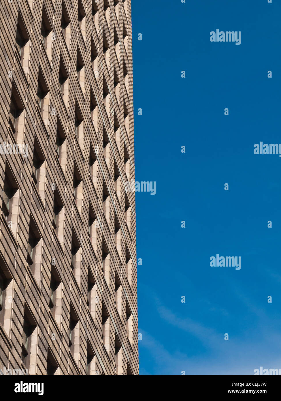 The geometric shapes and texture of the windows of a high rise building ...