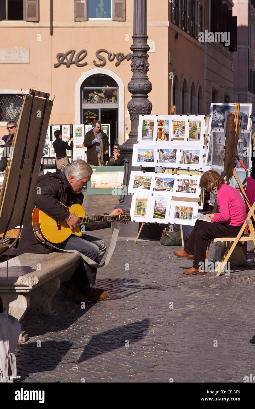 Artists and musicians entertain visitors on the in Piazza Navona in ...