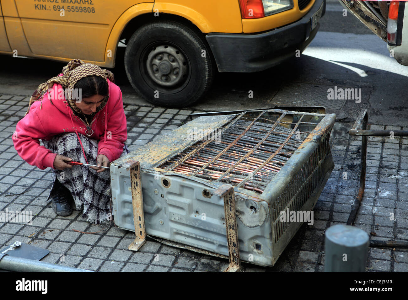 greece athens athinas street an indian woman collecting scrap metal Stock Photo