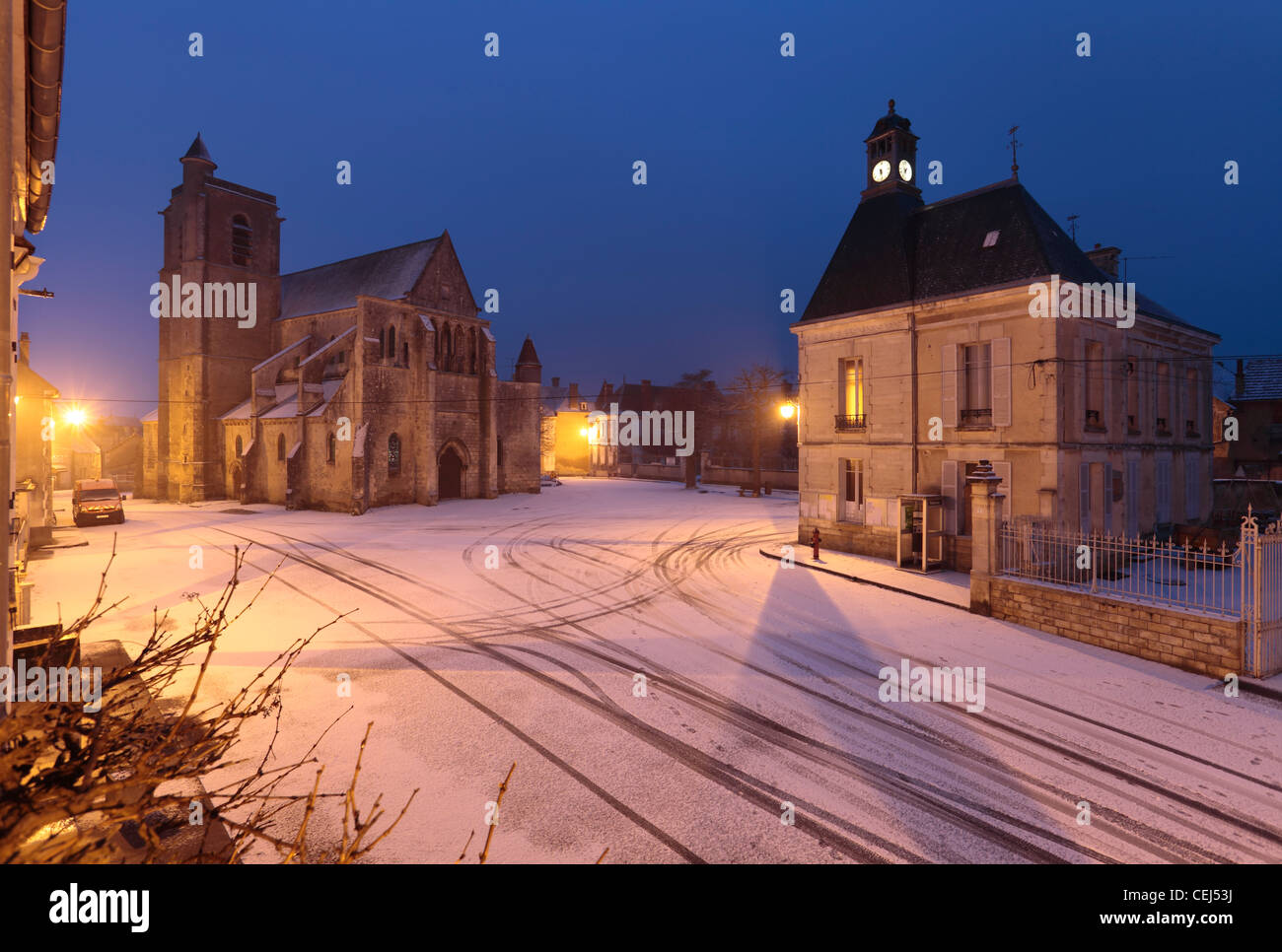 French village of Mailly le Chateau in snow in Winter. Stock Photo
