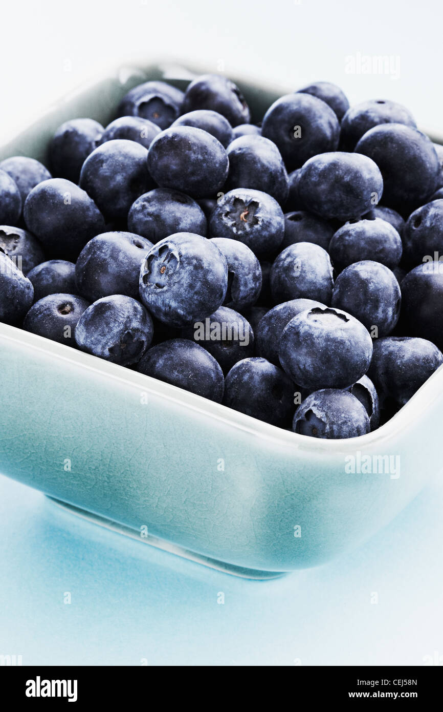 Close up of Blueberries in a light blue bowl Stock Photo